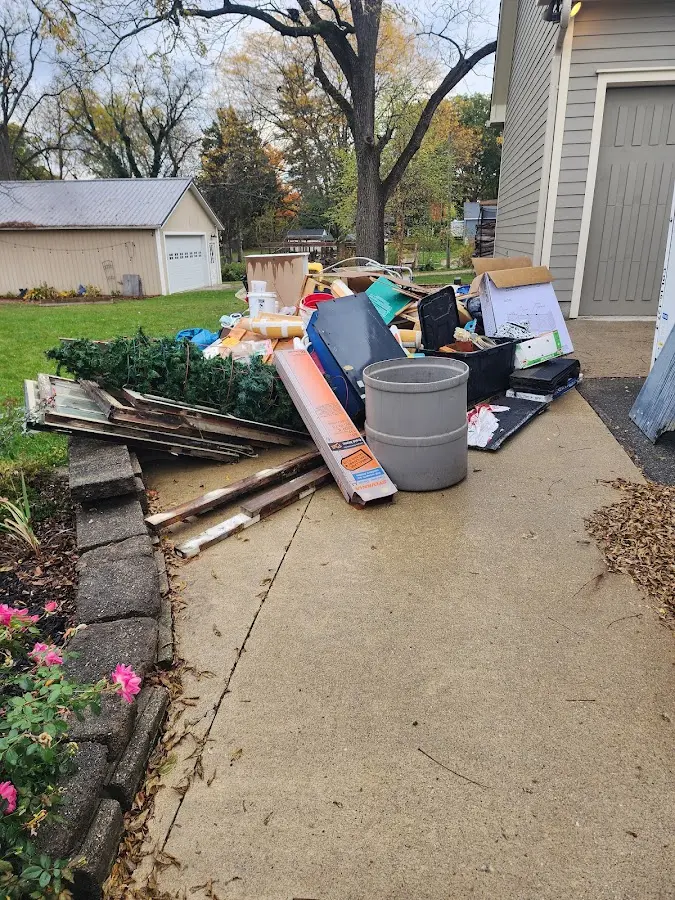 Dumpster being loaded with debris for Roofing Dumpster Rental in Lake Charles